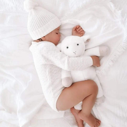 Baby cuddling Ditto heartbeat lamb — Baby Beats Australia